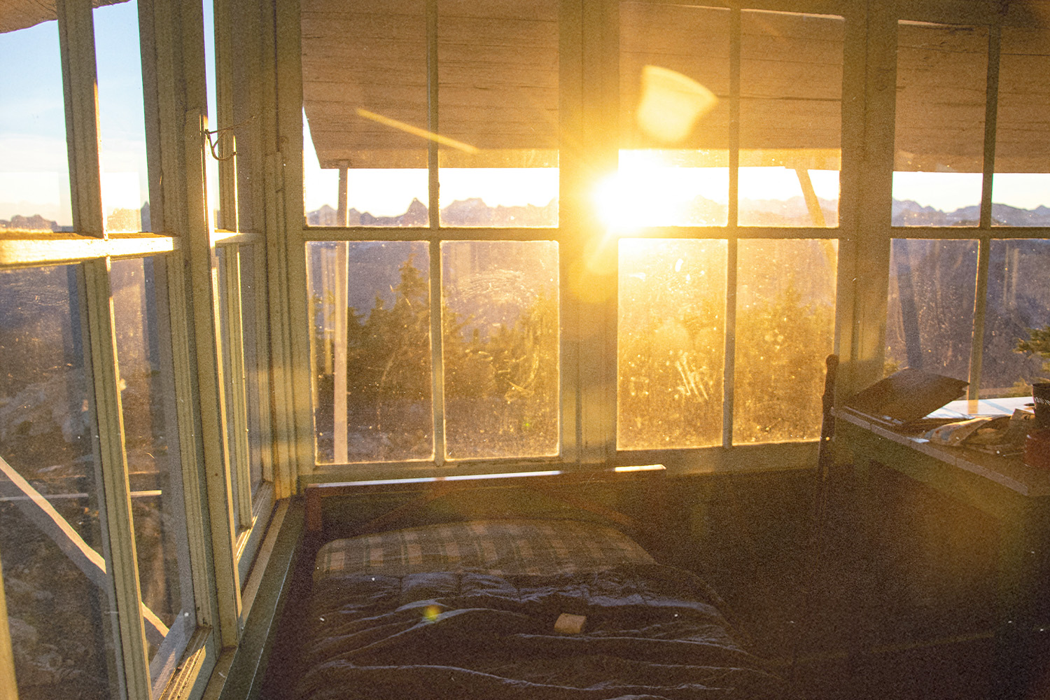 Sun pours in through a bedroom window in the city, representing starting your day with Giving Thanks.