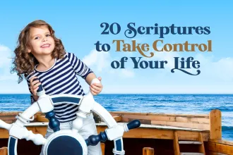 Kid behind the helm of a ship on the water